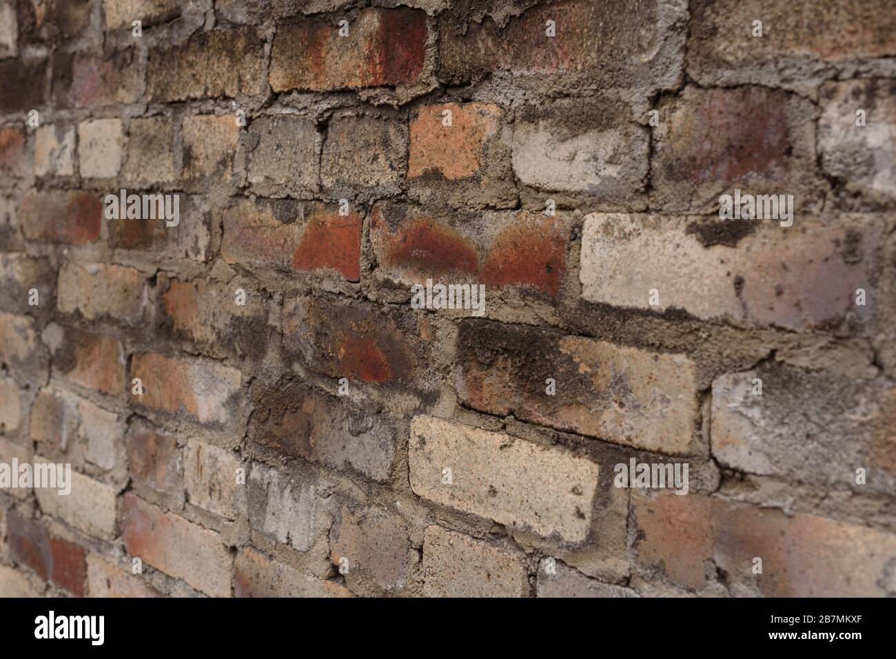 Weathered stained old brick wall background Stock Photo - Alamy