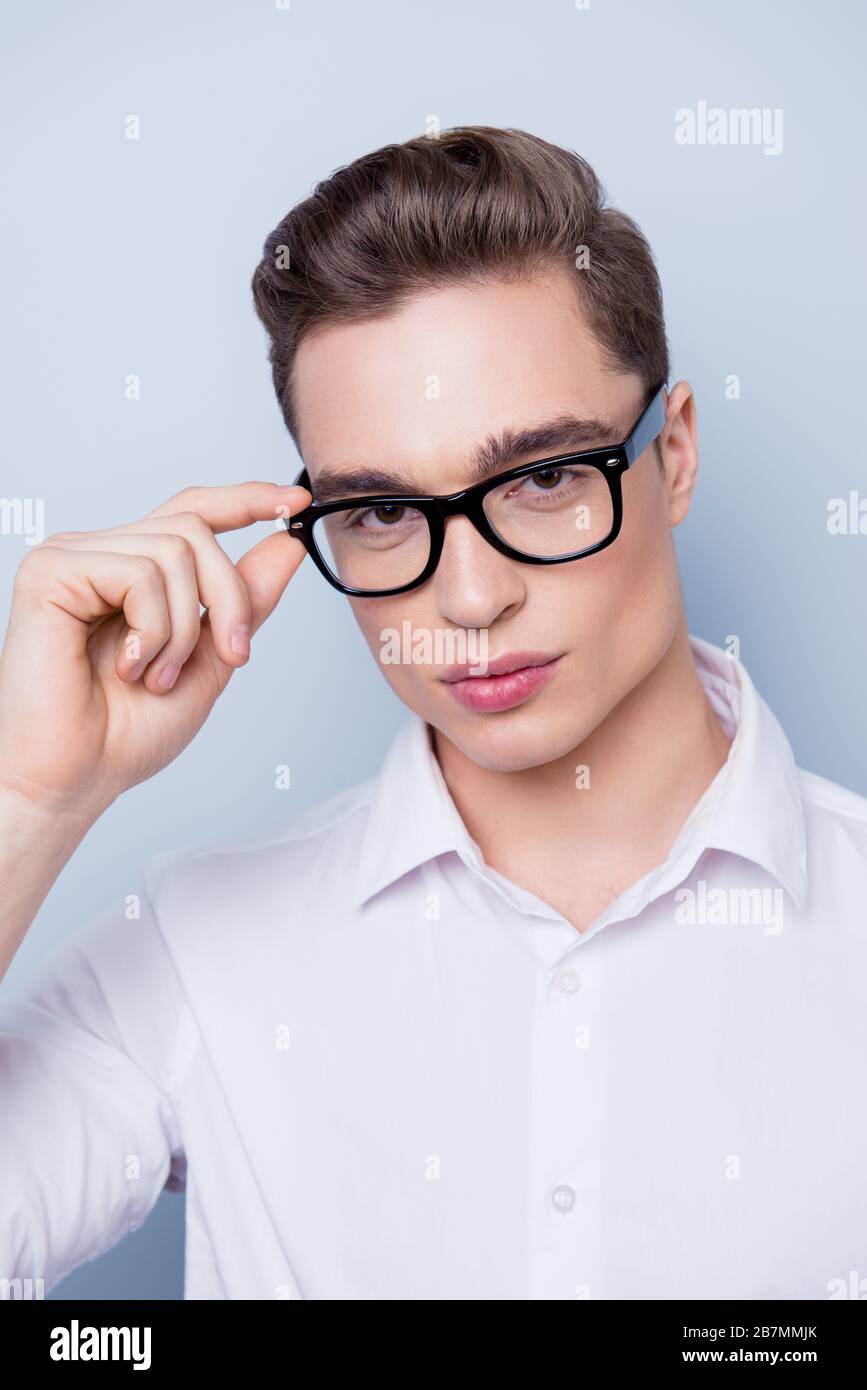 Close up portrait of attractive young man in white shirt and glasses ...