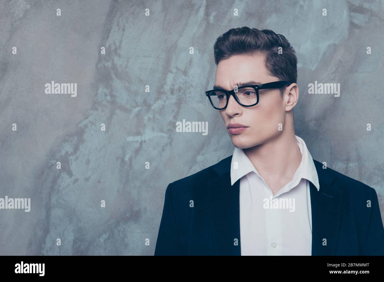 Close up portrait of attractive young guy in white shirt and jacket ...