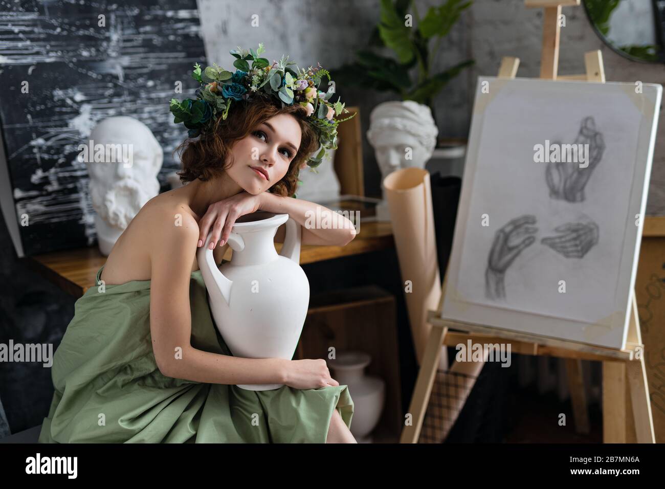 beautiful girl with flowers in the image of an ancient goddess Stock ...