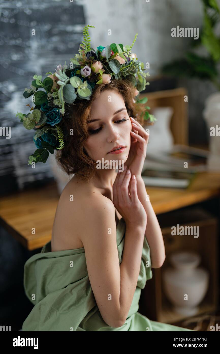 beautiful girl with flowers in the image of an ancient goddess Stock ...