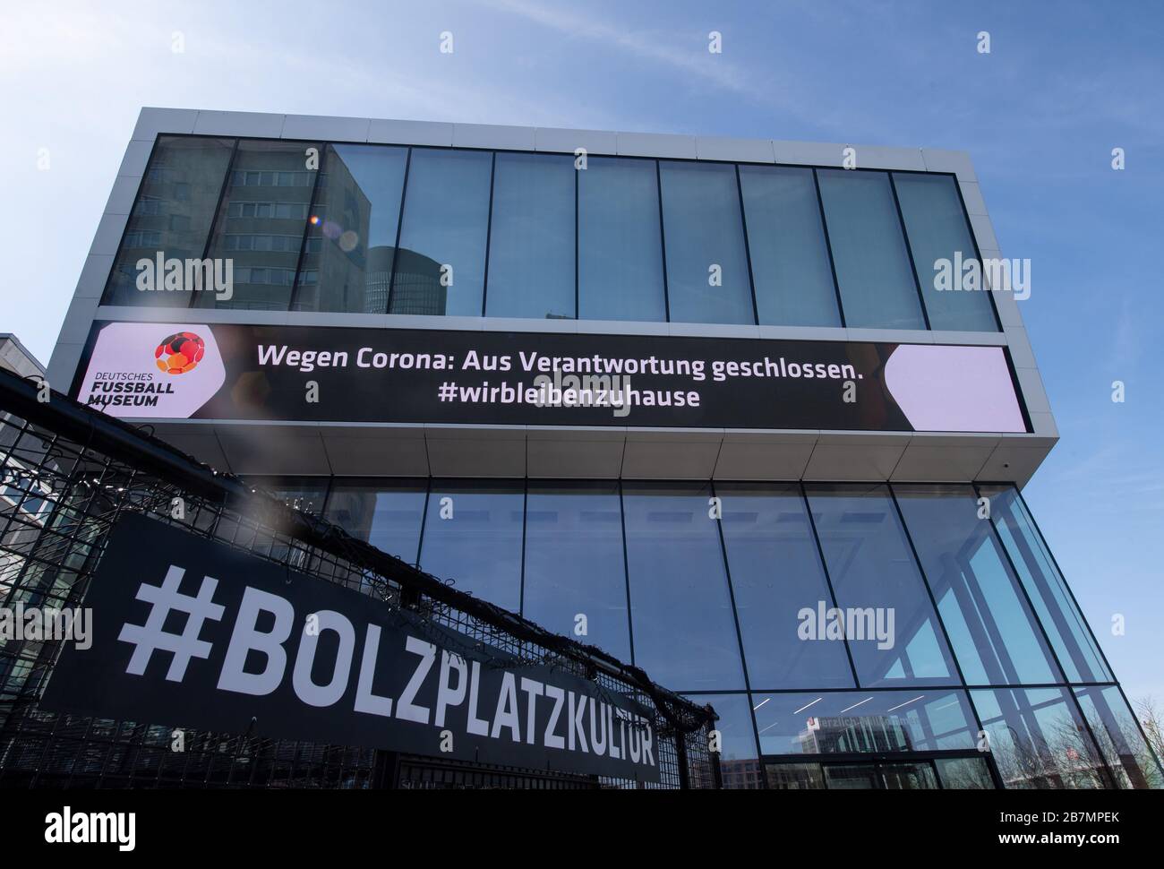 Dortmund, Germany. 17th Mar, 2020. The German Football Museum of the DFB writes on its LED band on the facade 'Wegen Corona: Aus Verantwortung geschlossen. #we stay at home '. Credit: Bernd Thissen/dpa/Alamy Live News Stock Photo