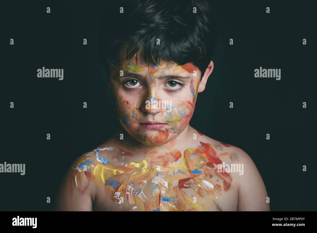 child with face painting on black background Stock Photo
