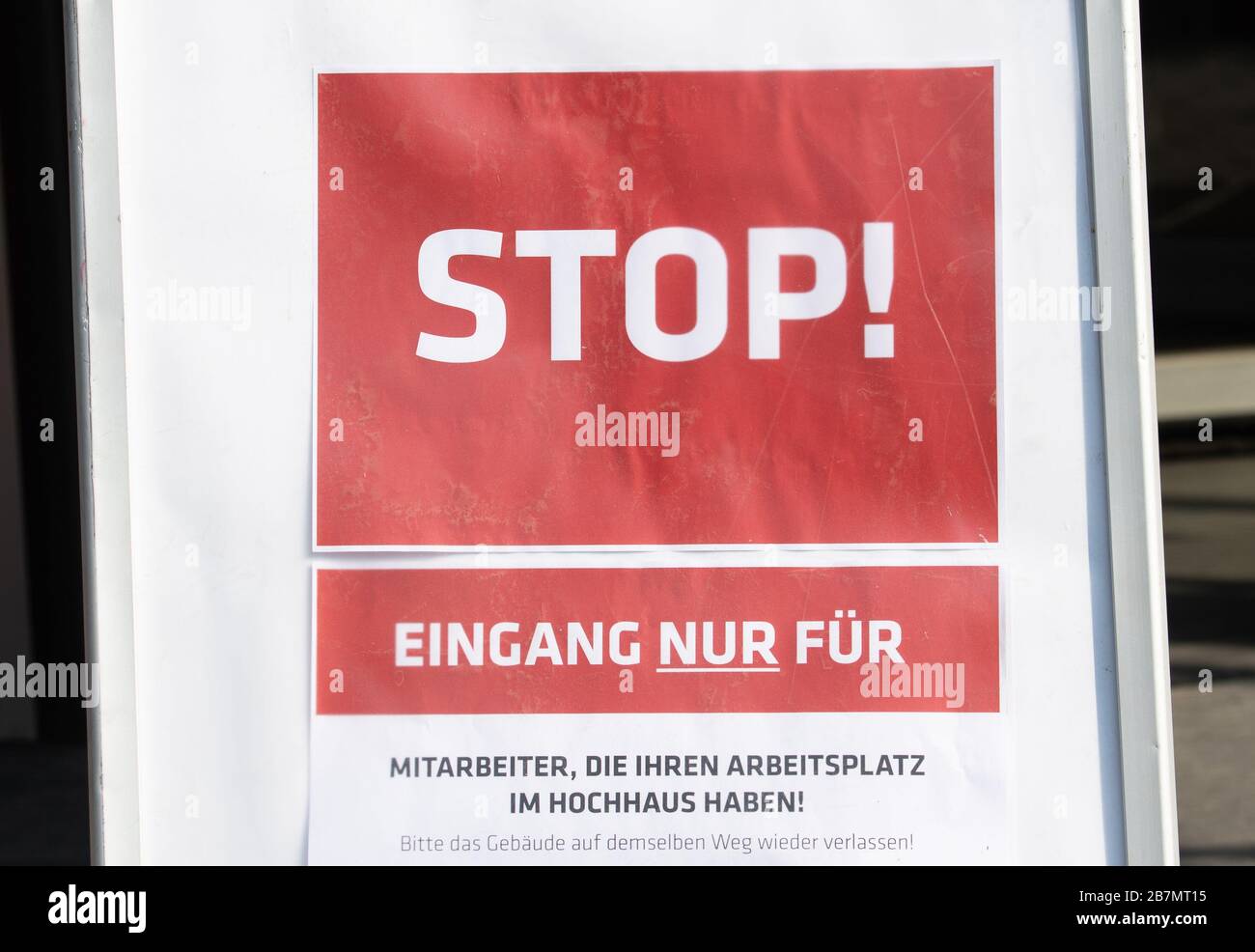 Dresden, Germany. 17th Mar, 2020. In the fight against the spread of the novel coronavirus, a sign in front of the press building reads 'Stop! entrance only for employees who have their workplace in the high-rise building! Credit: Robert Michael/dpa-Zentralbild/dpa/Alamy Live News Stock Photo