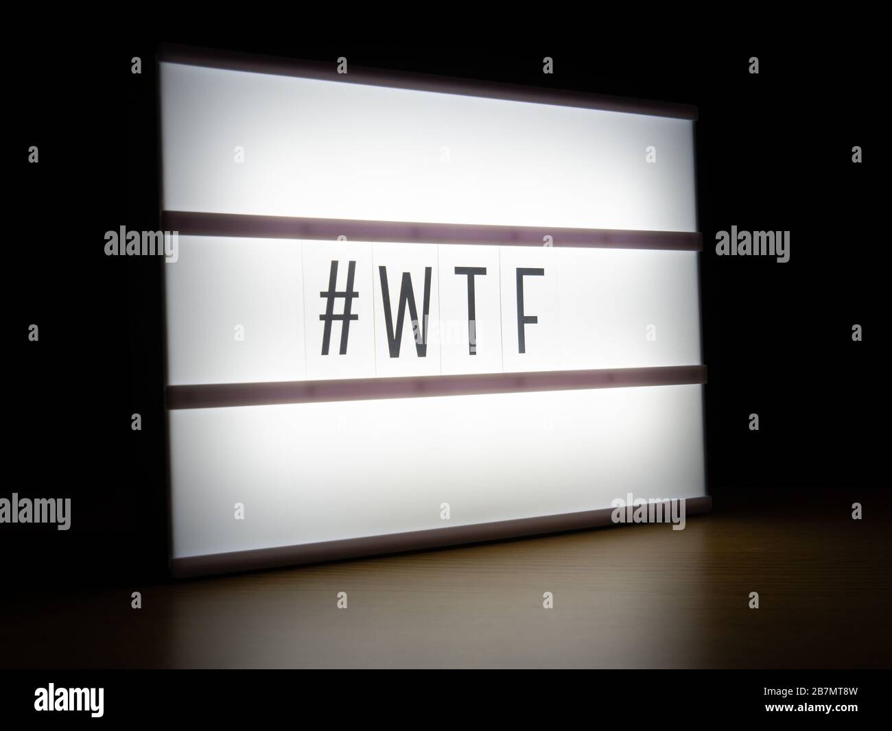 LED light box hashtag WTF message board in dark Stock Photo - Alamy