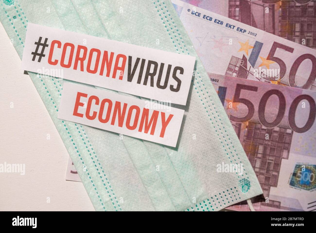 Corona virus impact on European economy concept, banknotes with medical mask Stock Photo