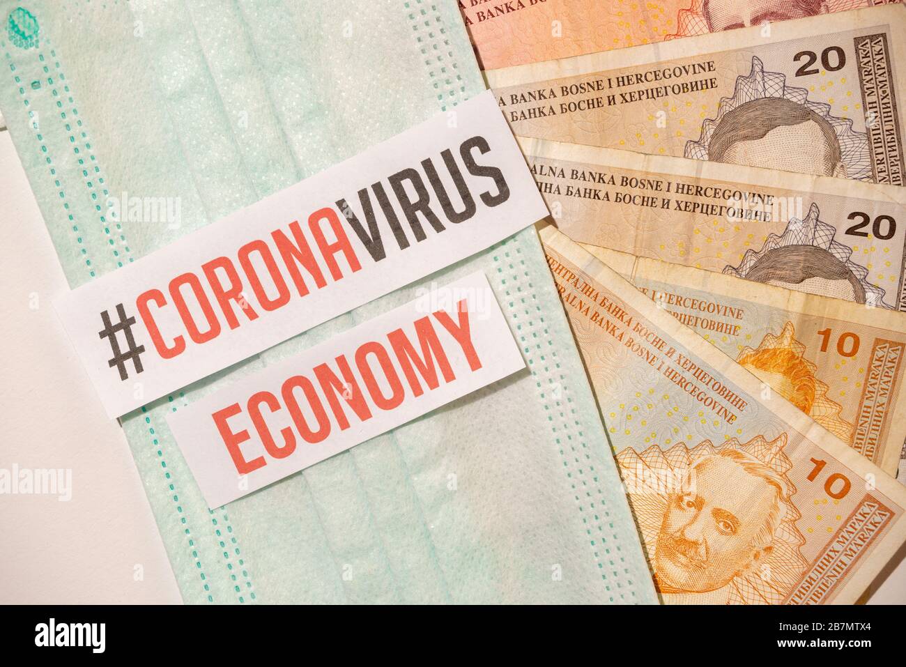 Corona virus impact on Bosnian economy concept, banknotes with medical mask corona virus covid-19 Stock Photo