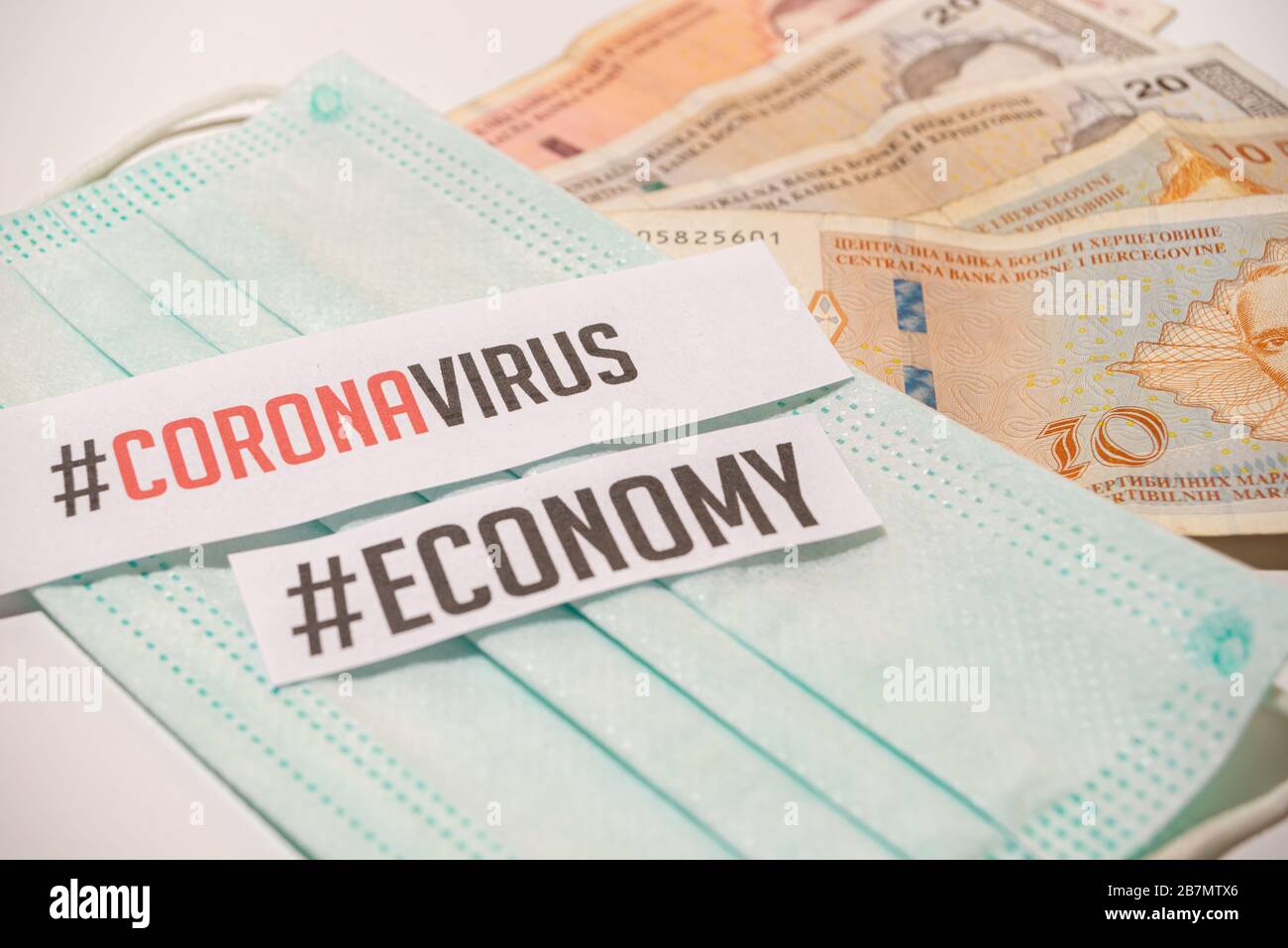Corona virus impact on Bosnian economy concept, banknotes with medical mask corona virus covid-19 Stock Photo