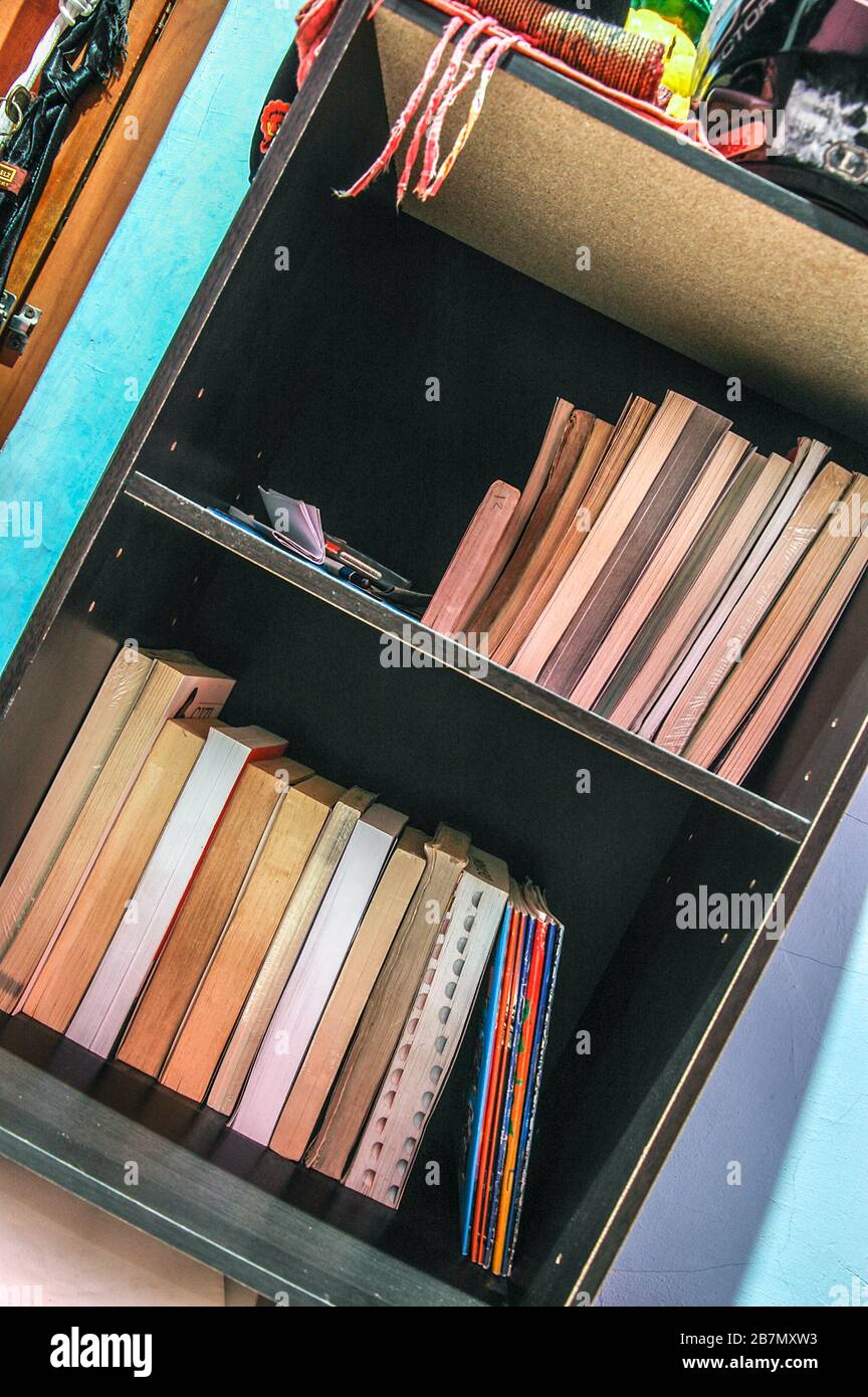 books in a bookshelf askew Stock Photo