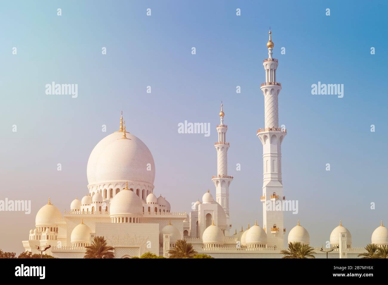 Beautiful view of the wonderful white mosque of Sheikh Zayed in Abu Dhabi against a clear sky on a sunny day Stock Photo