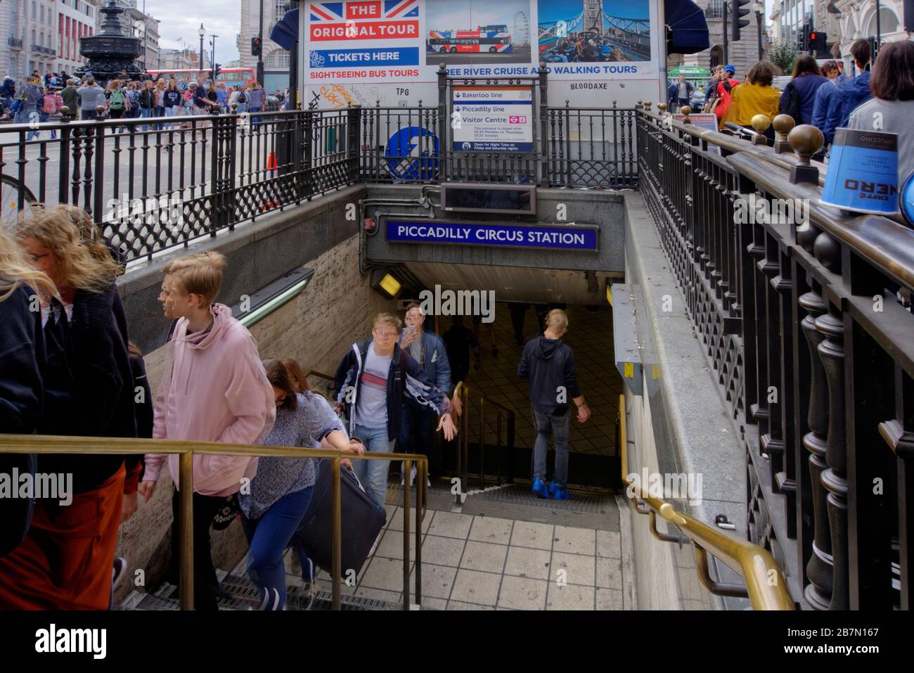 London, United Kingdom - September 7, 2019: Subway entrance to Piccadilly Circus tube station with numerous tourists walking up and down steps. Stock Photo