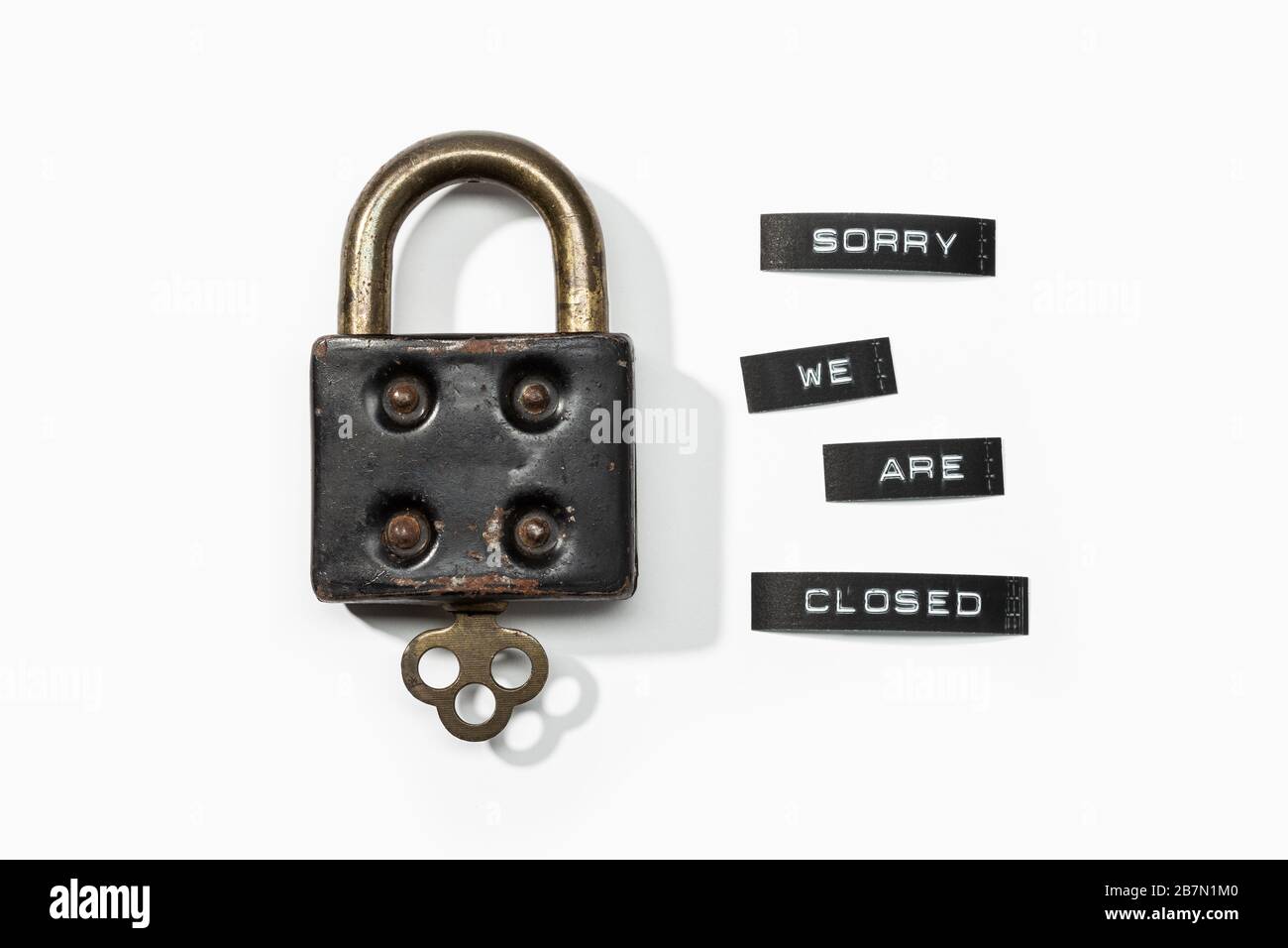 Padlock with label sorry we are closed isolated on white background. Closed by coronavirus or covid-19 concept Stock Photo