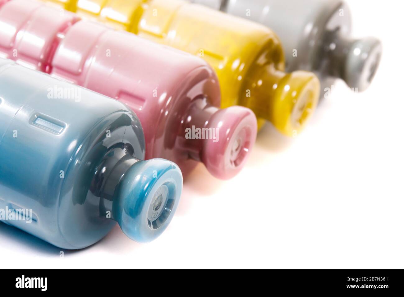 cartridges for laser printers aligned on a white background. Stock Photo
