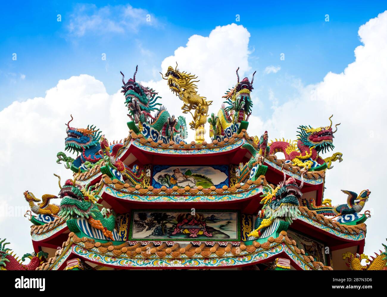 Colorful chinese dragon and swan statues adorned the rooftops of ...