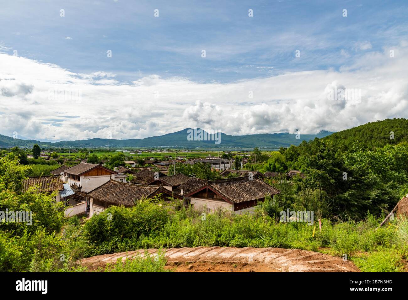 View of a Naxi people village by the Lashi Lake, from a seection of the ancient tea horse road, chamagudao, in Yunnan, China. Stock Photo