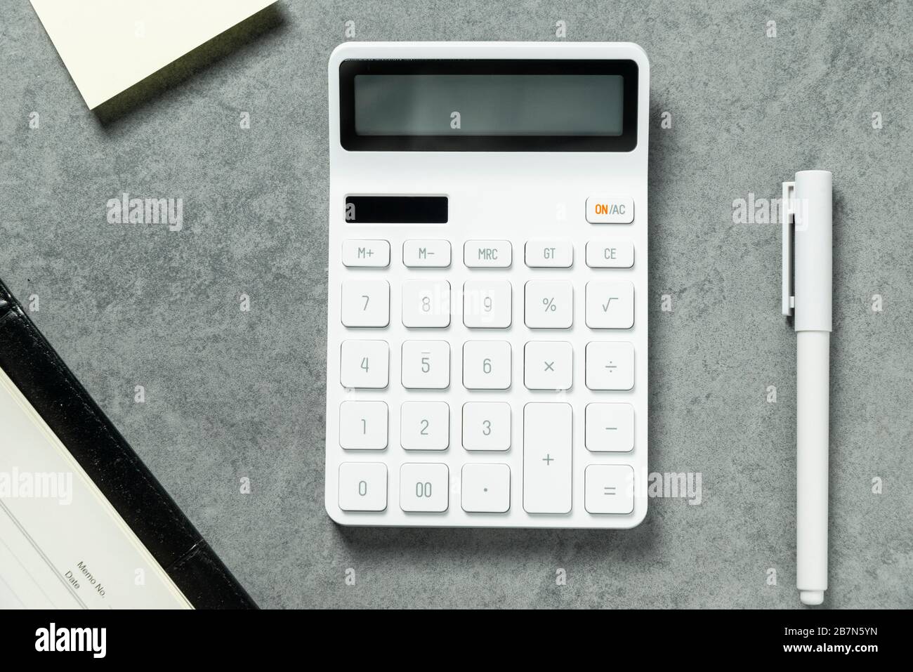A calculator on the table.The Chinese meaning is: financial resources expand Stock Photo