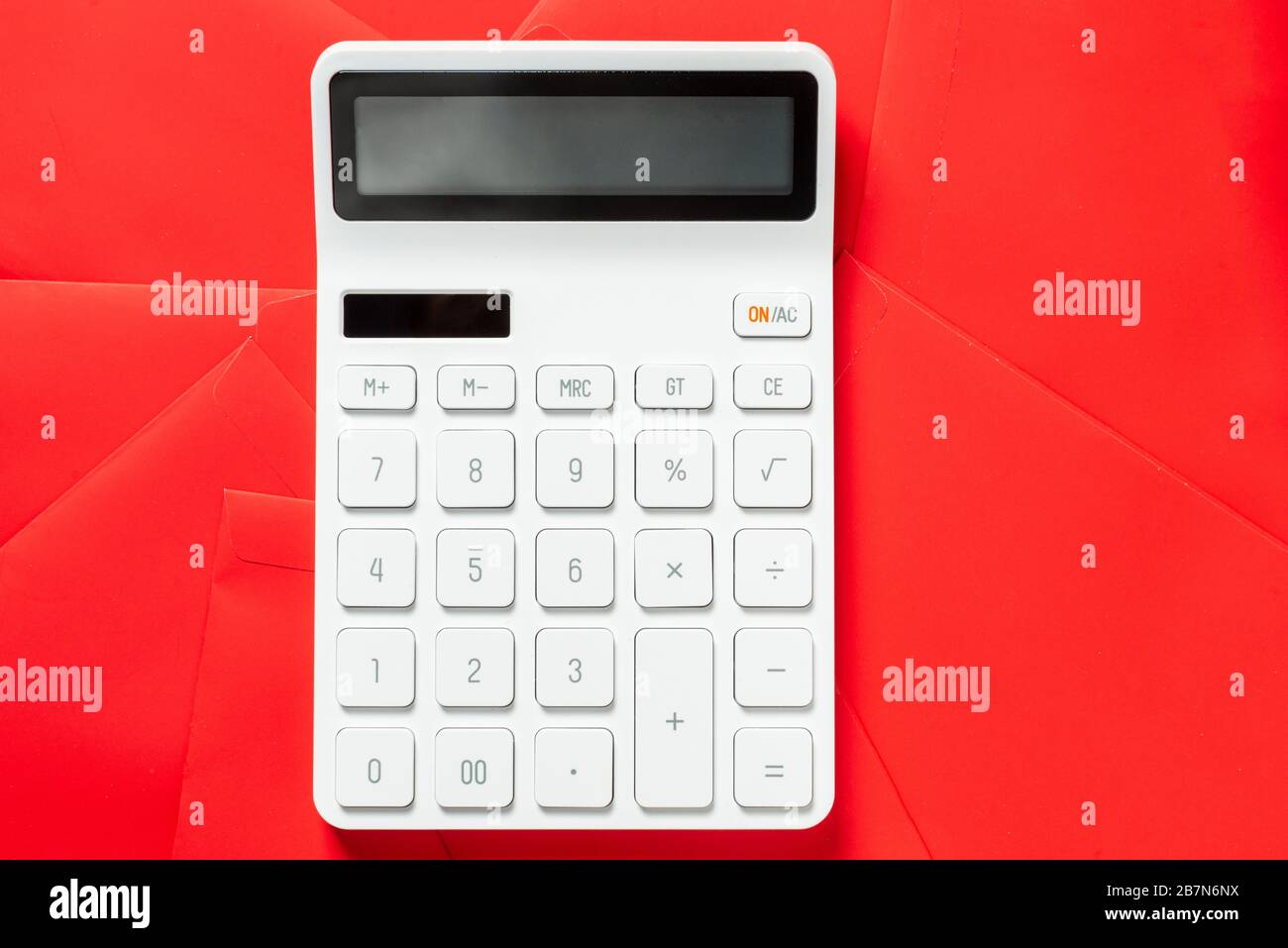 A calculator on the table.The Chinese meaning is: financial resources  expand Stock Photo - Alamy