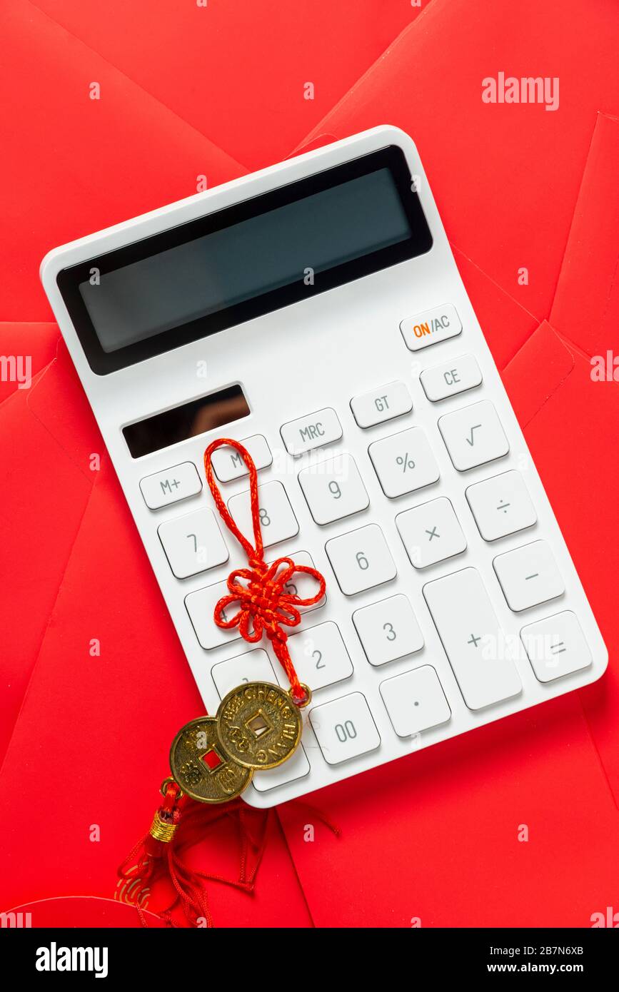 A calculator on the table.The Chinese meaning is: financial resources expand Stock Photo