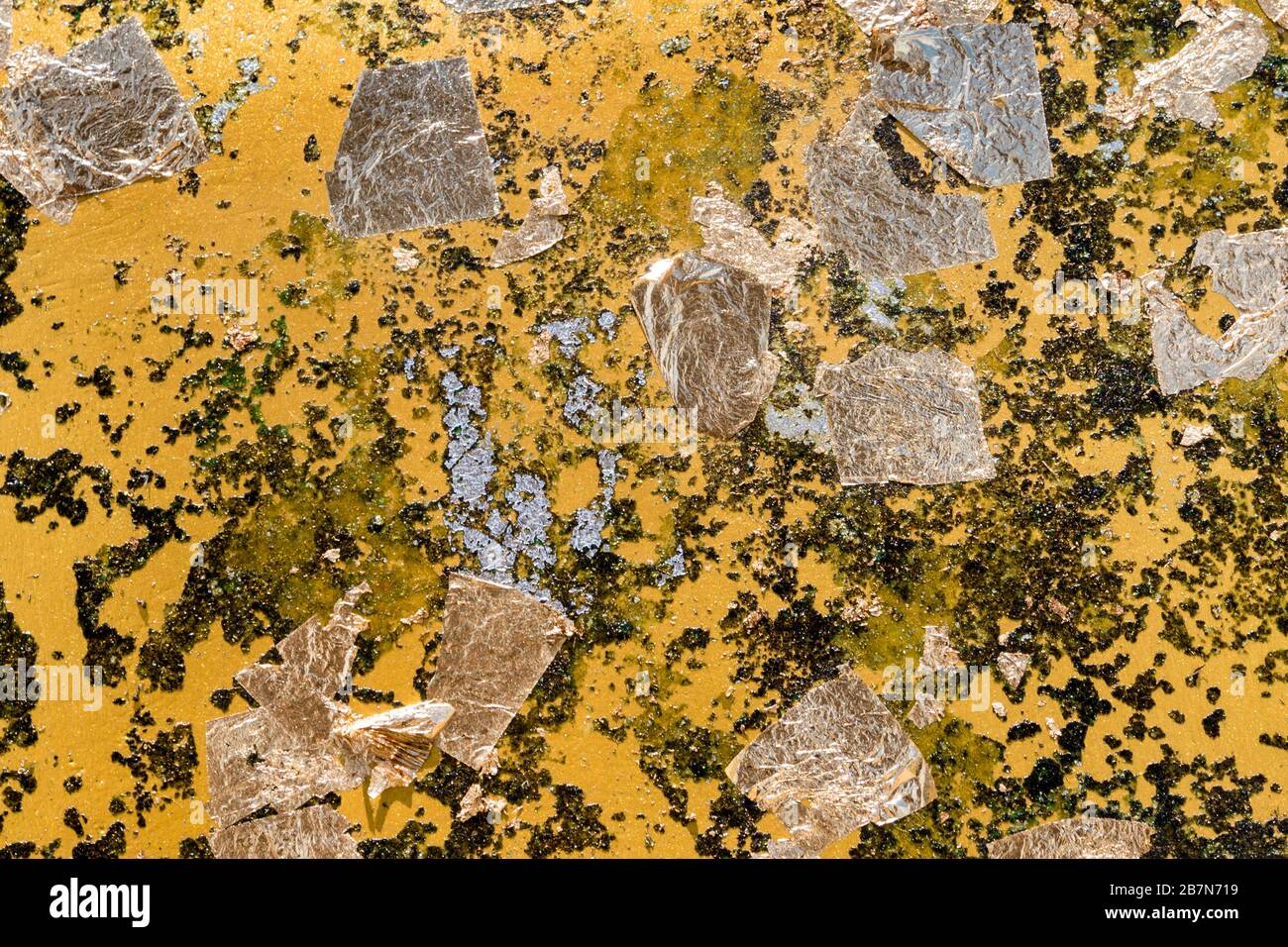 Texture of Golden leaf taped on the Buddha statue Stock Photo