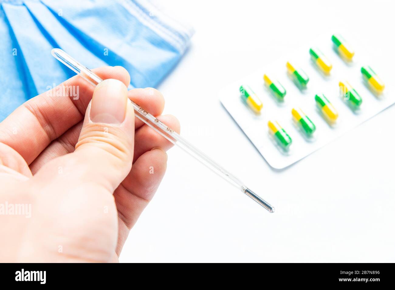 Thermometers and anti flu drugs Stock Photo