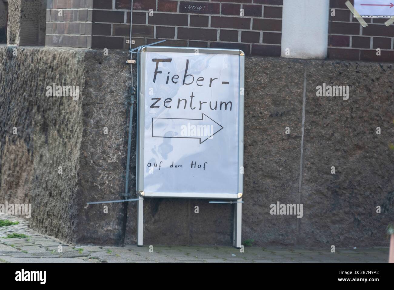 Magdeburg, Germany. 17th Mar, 2020. Germany, Magdeburg: In the state capital of Magdeburg, the first fever outpatient clinic was established due to the corona pandemic. Signs show sick patients the way. Credit: Mattis Kaminer/Alamy Live News Stock Photo