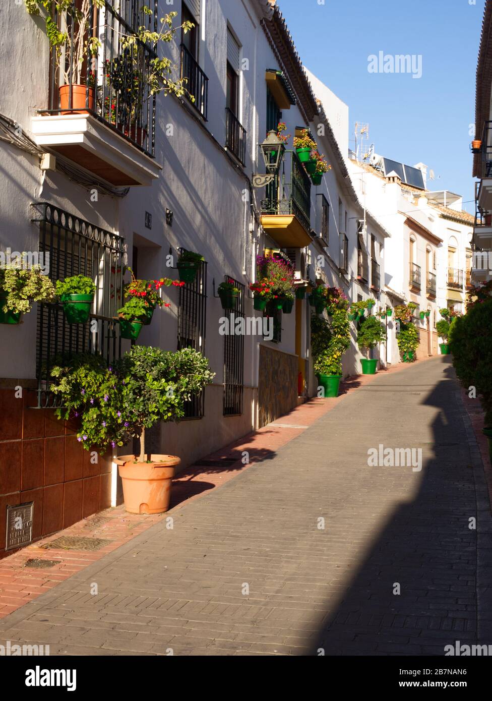 Breathtaking Estepona, Spain. The City of Flowers. Each cobbled street is lined with its individual coloured flower pots. Shops, restaurants, Culture. Stock Photo