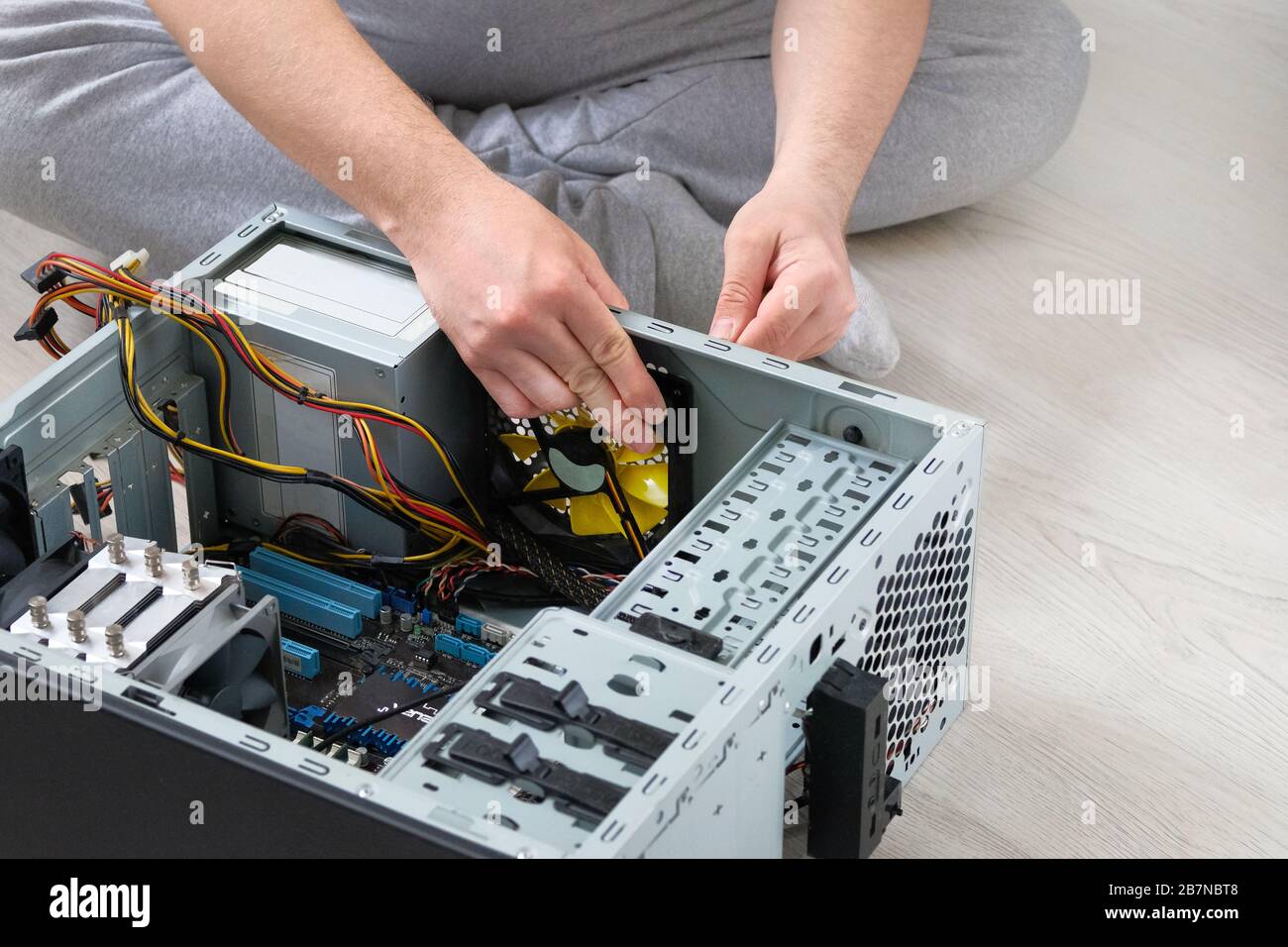 Service electronics and computers concept. Computer engineer is repairing CPU. Computer repair. Stock Photo