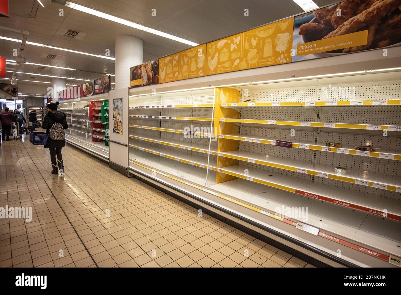 Empty shelves in a supermarket which usually contain fresh meat and