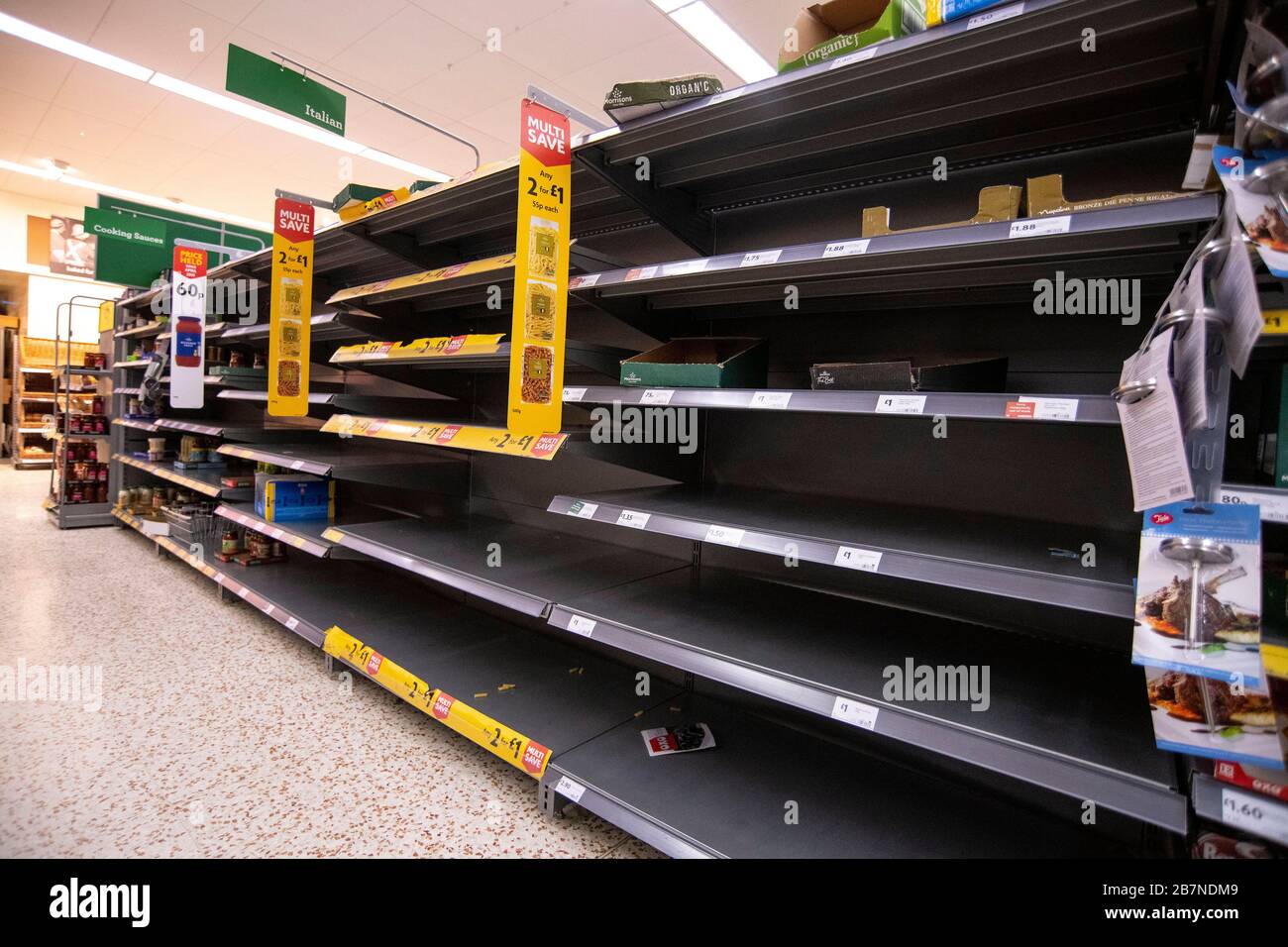 Empty shelves and quantity restriction signs in a Morrisons supermarket in Bath, Somerset as panic buying continues during the Coronavirus outbreak. Stock Photo