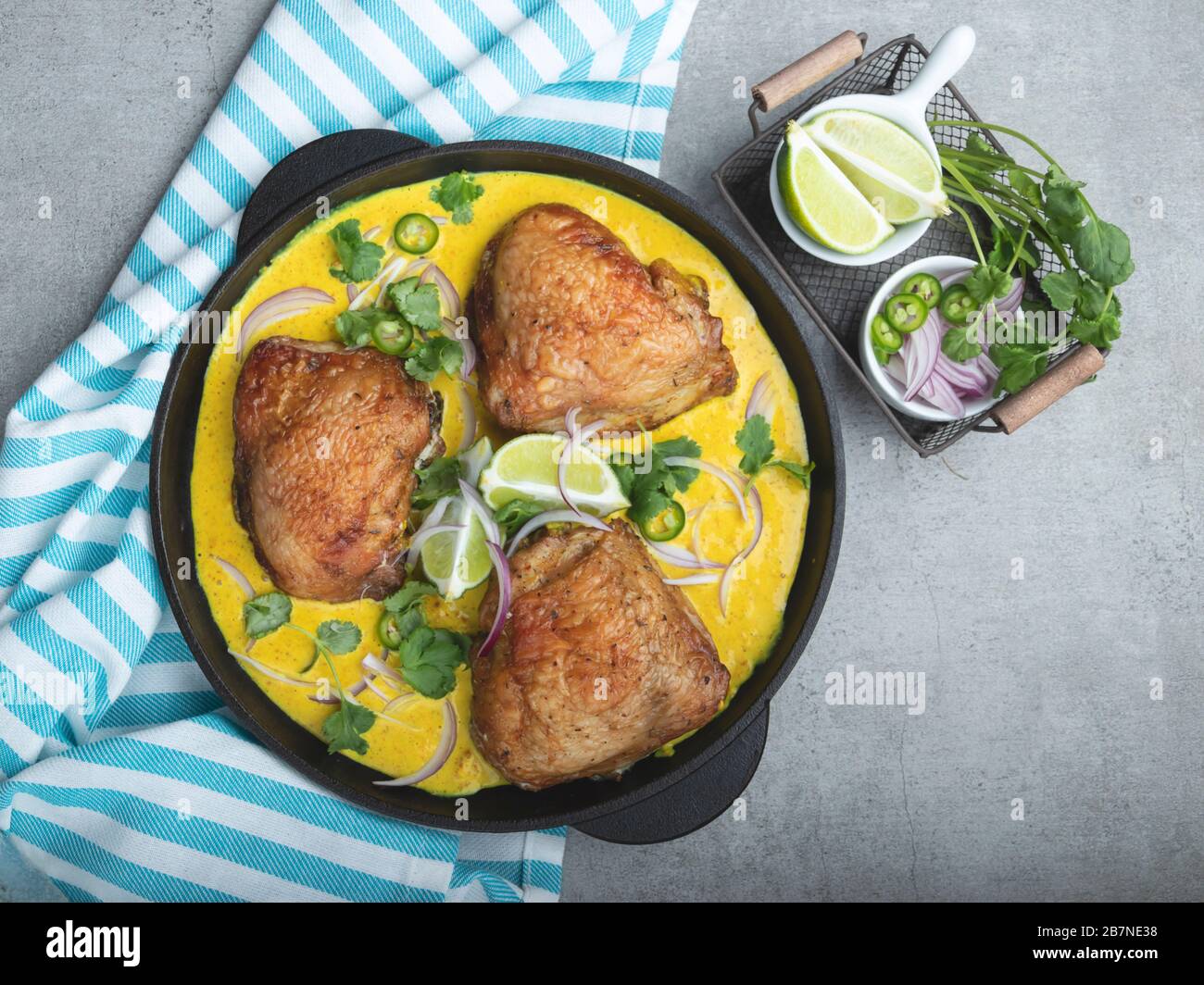 baked chicken thigh with curry sauce Stock Photo Alamy