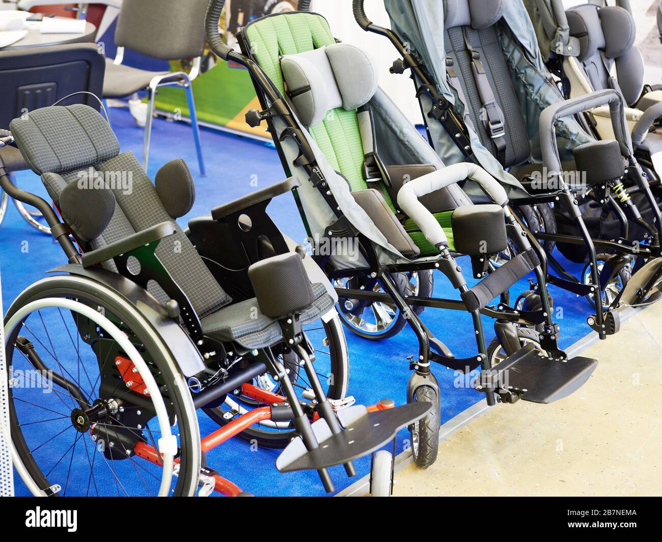 Wheelchairs for children on exhibition store Stock Photo Alamy