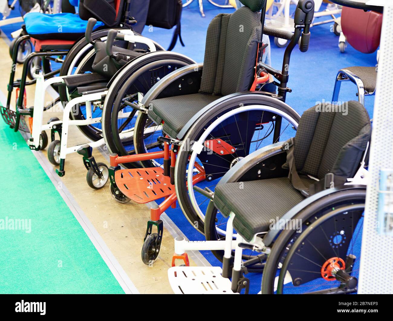 Wheelchairs for children on exhibition store Stock Photo Alamy