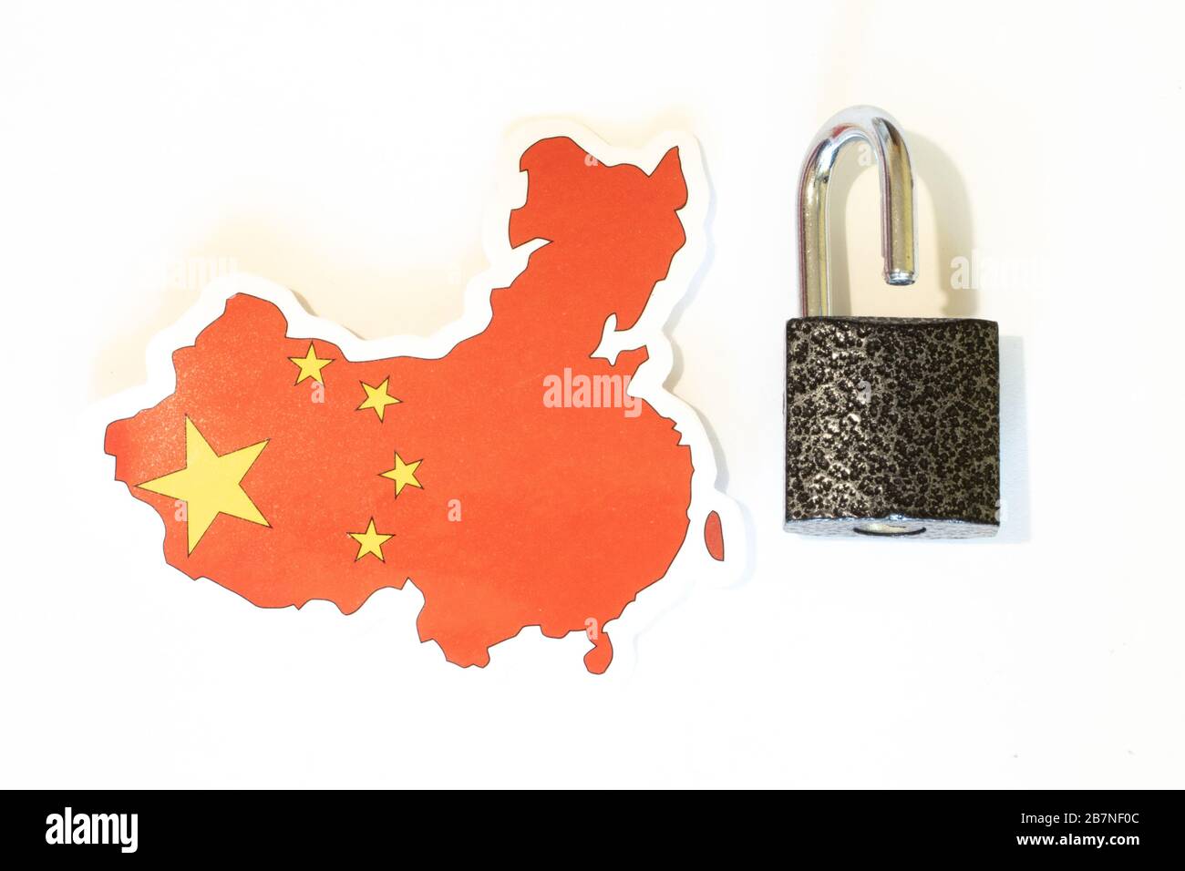 China national flag with outline on white background with open lock top view. The concept of opening the borders of the country Stock Photo