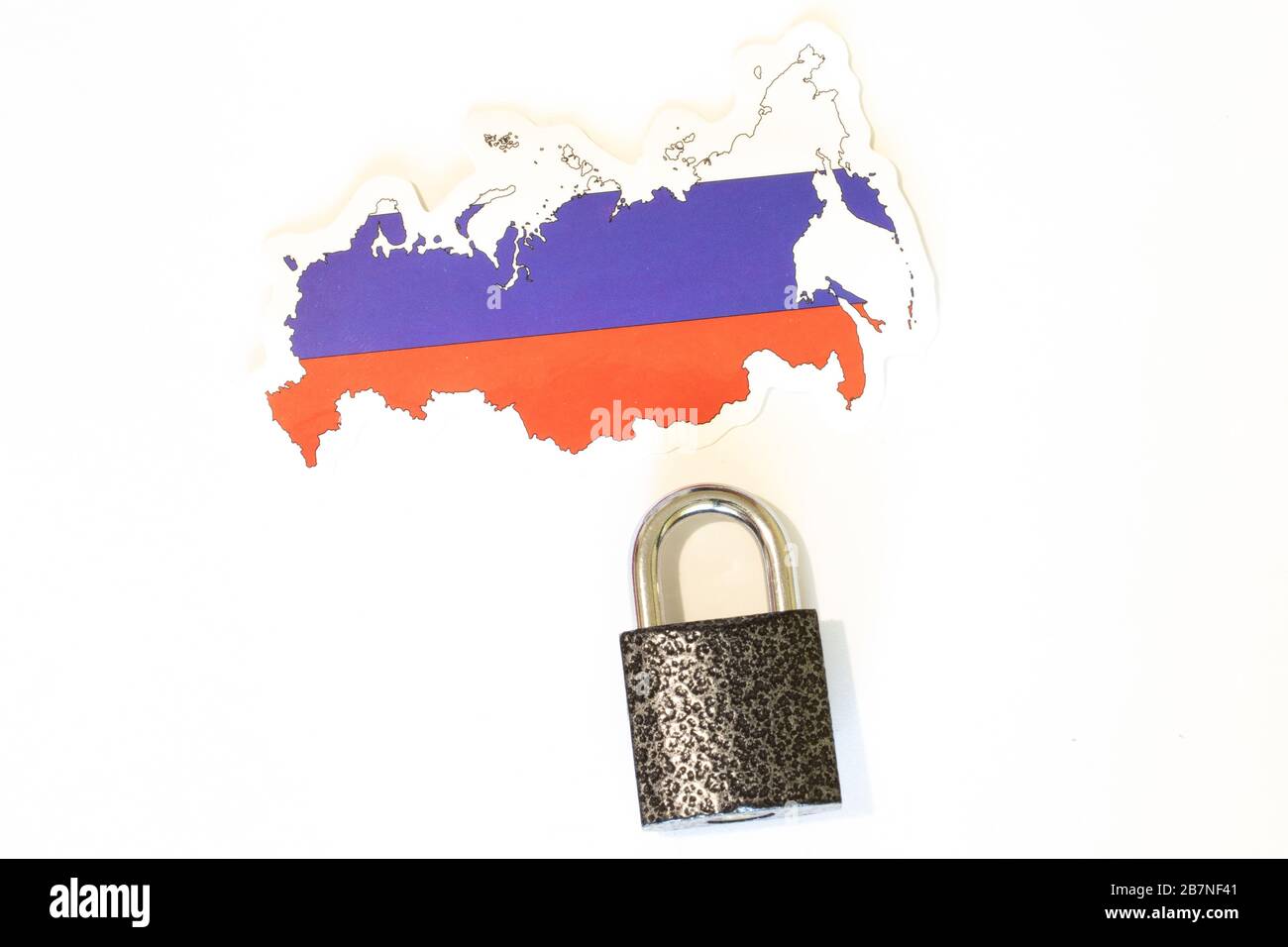 Russia national flag with outline on a white background with a closed lock top view. The concept of closing the borders of the country. Country Stock Photo