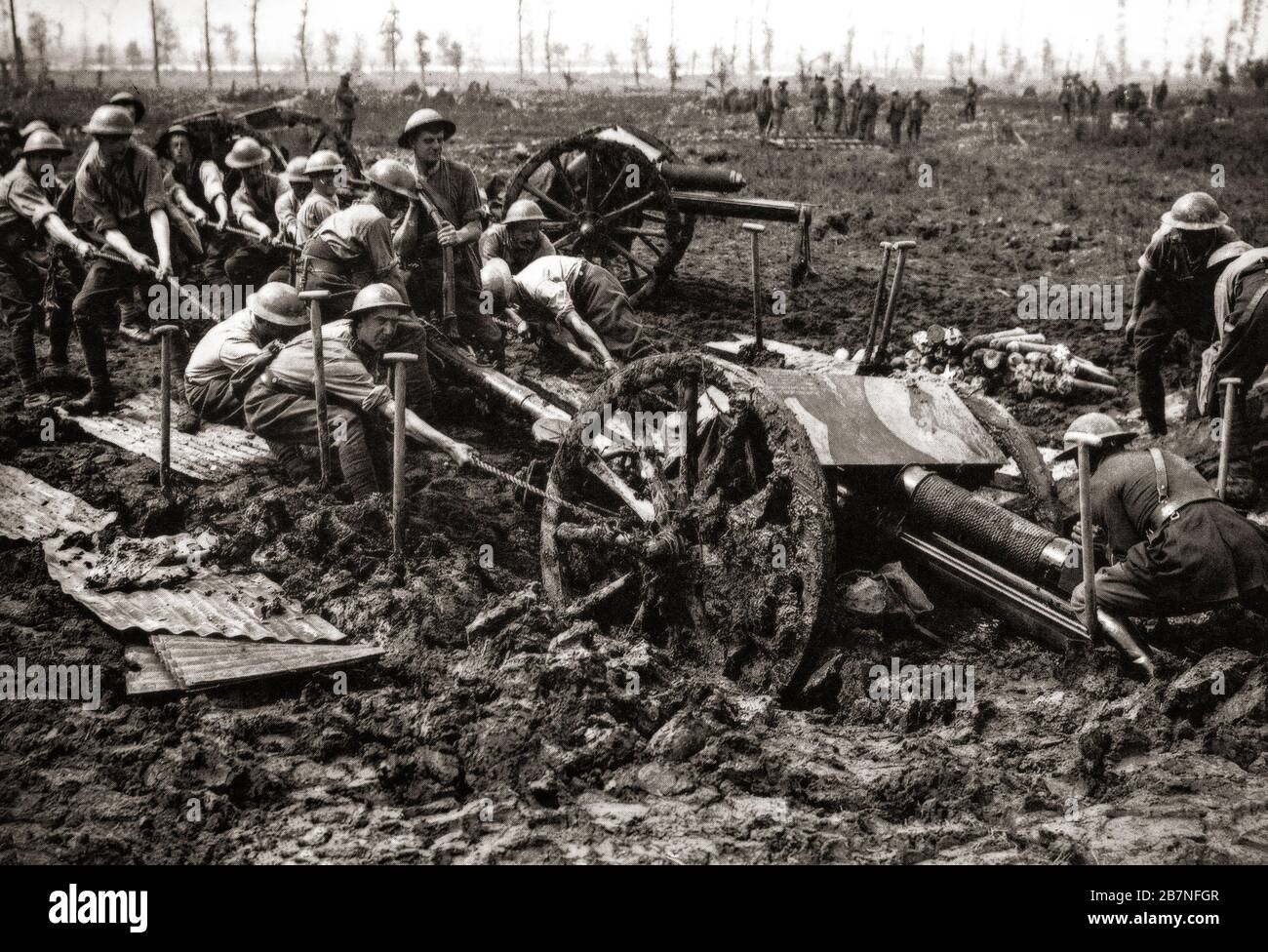 Artillery men hauling an 19 pounder field gun out of the mud during the Third Battle of Ypres aka the Battle of Passchendaele, a campaign of the First World War, that took place on the Western Front, from July to November 1917, for control of the ridges south and east of the Belgian city of Ypres in West Flanders. Stock Photo