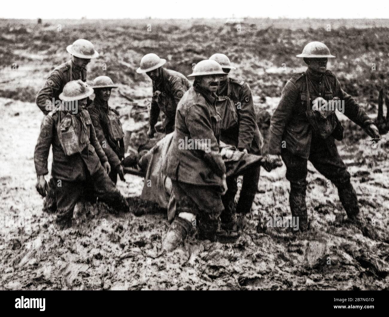 Stretcher bearers hauling a wounded soldier through the mud during the The Battle of Pilckem Ridge, the opening attack of the Third Battle of Ypres aka the Battle of Passchendaele, a campaign of the First World War, that took place on the Western Front, from July to November 1917, for control of the ridges south and east of the Belgian city of Ypres in West Flanders. Stock Photo