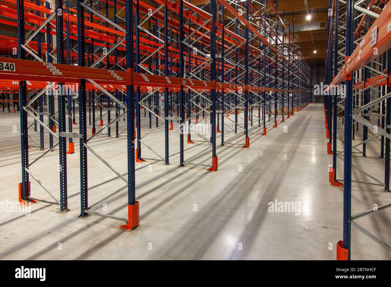 Interior shot of warehouse with storage racks Stock Photo - Alamy