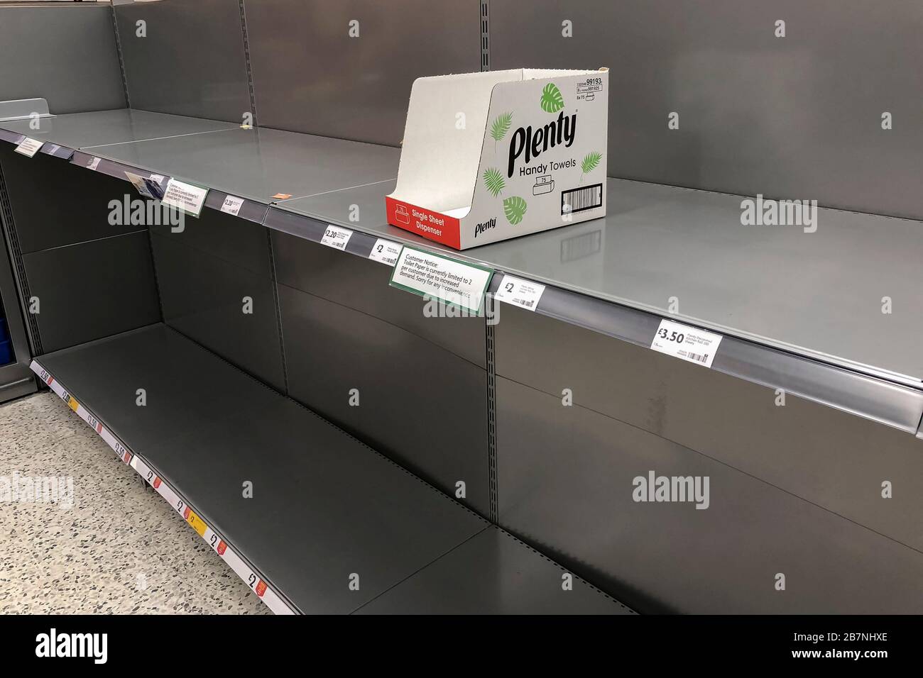 Bridport, Dorset, UK.  17th March 2020.  Empty shelf in the hand towel aisle with an empty box of Plenty in a Morrisons supermarket at Bridport in Dorset due to panic buying because of the coronavirus/Covid-19.  Picture Credit: Graham Hunt/Alamy Live News Stock Photo