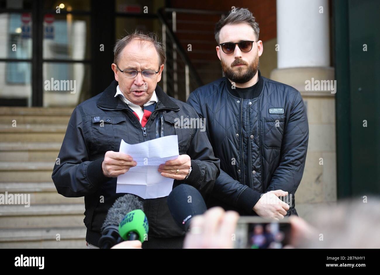 Paul Hett, father of Manchester Arena attack victim Martyn Hett, (with Martyn's brother Matt, right) speaking outside Manchester Minshull Court after Hashem Abedi, the brother of Manchester Arena suicide bomber Salman Abedi, was found guilty at the Old Bailey in London of murder over the bombing that killed 22 people. Stock Photo