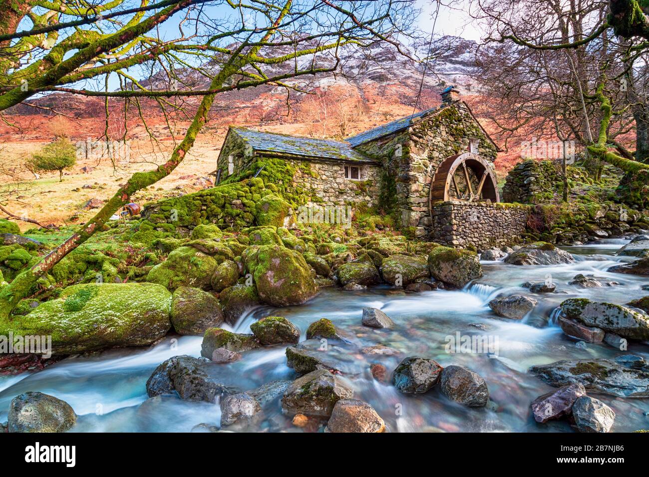 An old water mill on the banks of Combes Gill in Borrowdale valley in the Lake District National Park in Cumbria Stock Photo