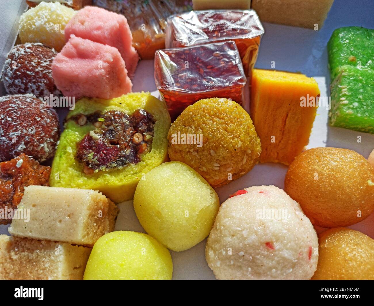 High angle shot of different types of sweets of various colors on a ...