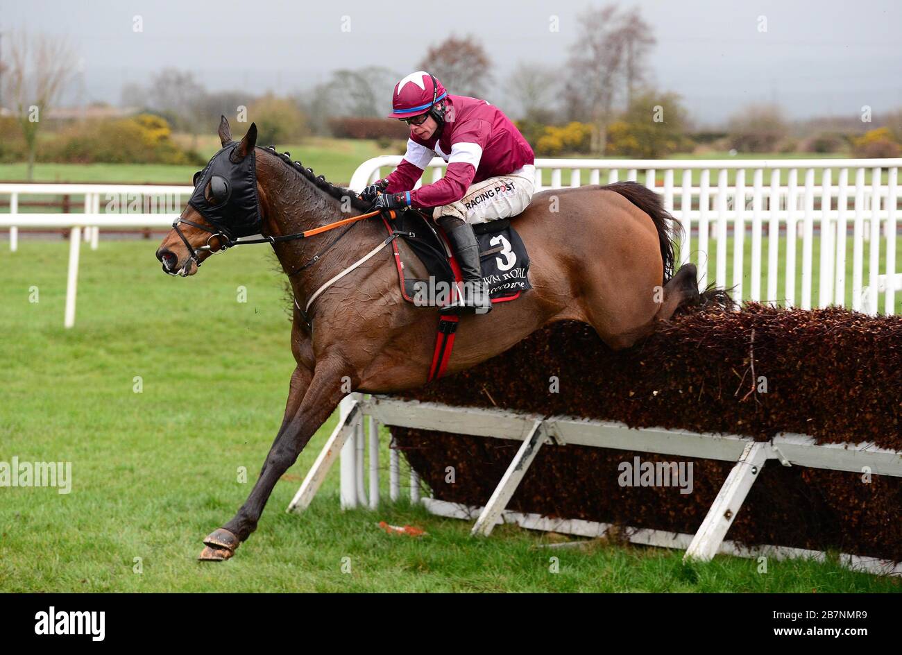 Monbeg Notorious and Denis O'Regan clear a fence on the way to winning the Racing TV Chase during today's meet at Down Royal Racecourse, Lisburn, which is being held behind closed doors because of the Coronavirus. Stock Photo