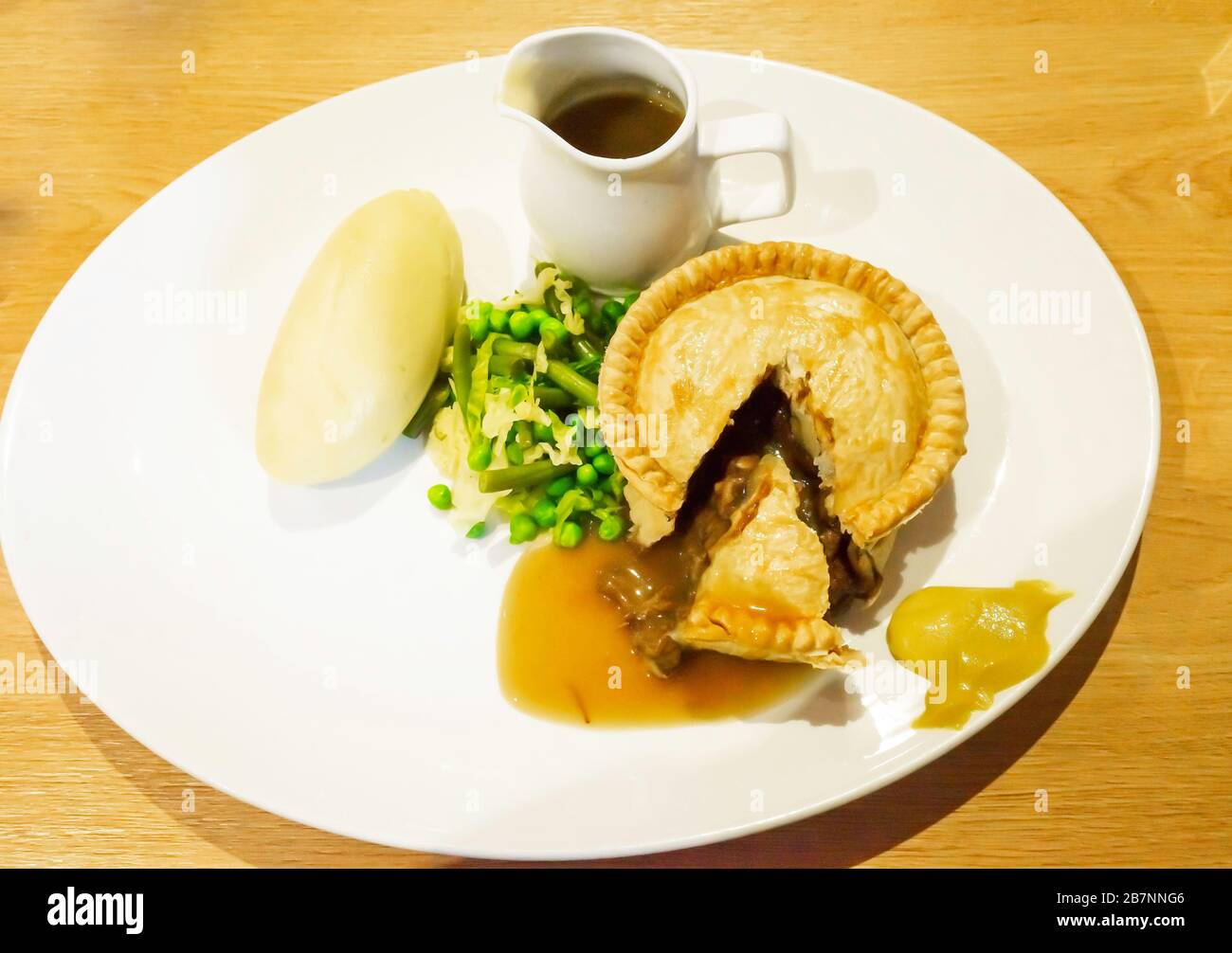 Tasty Yorkshire meal at Lord Stones café steak pie with mashed potato green beans peas cabbage