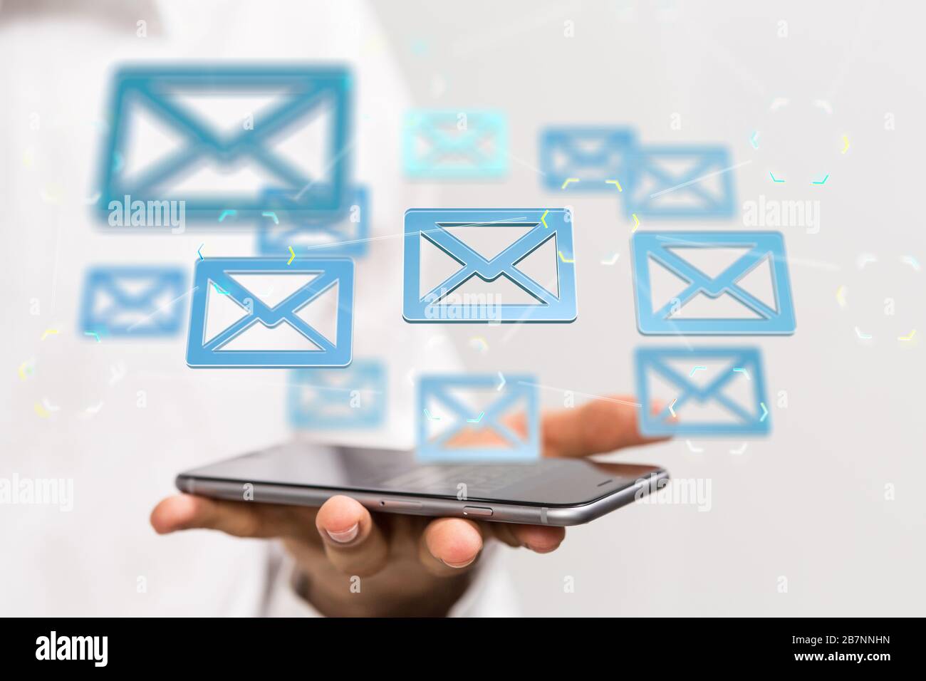 Man holding message icons-social media concept Stock Photo - Alamy