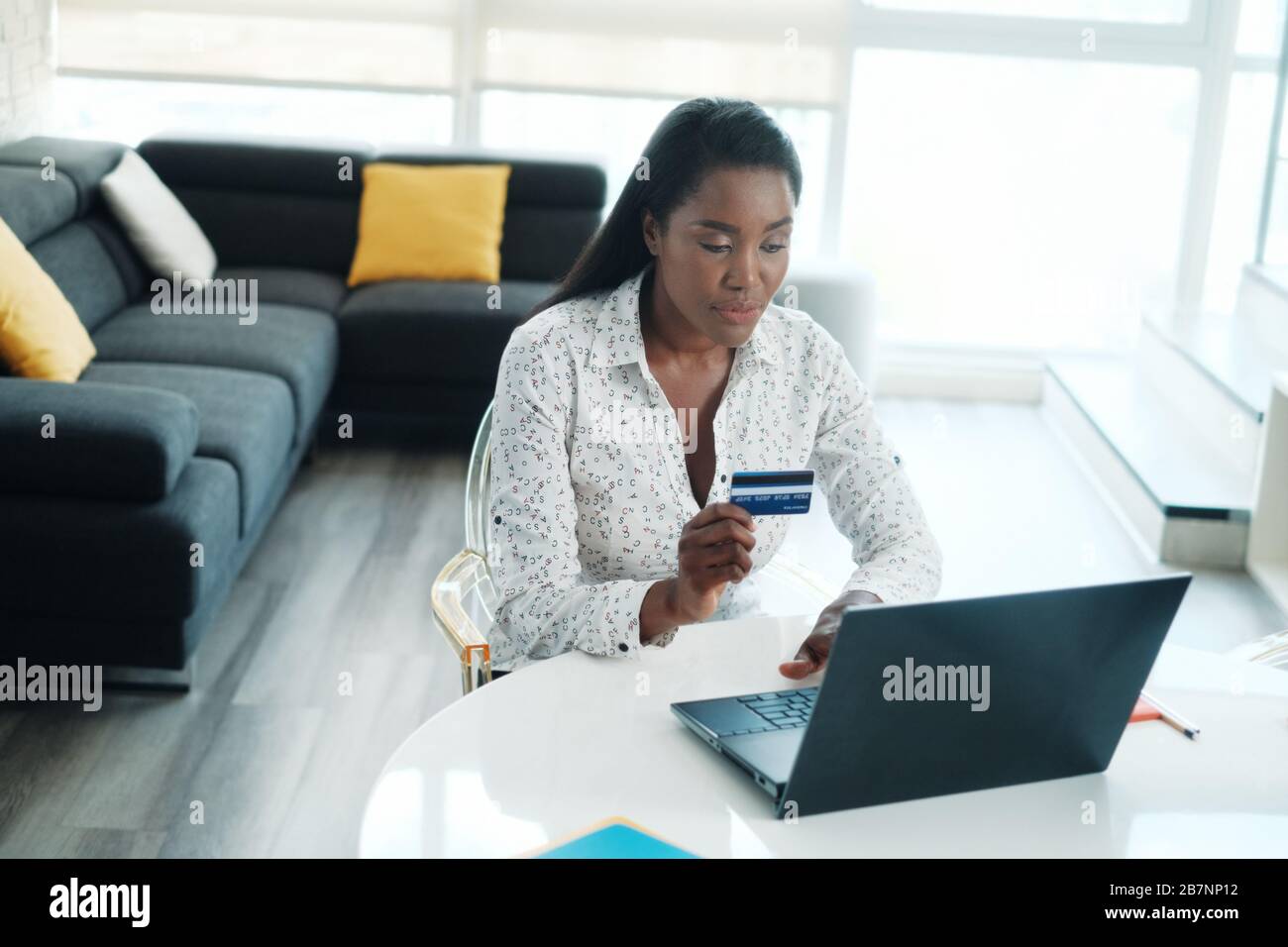 Black Woman Paying Online Purchase With Credit Card Stock Photo