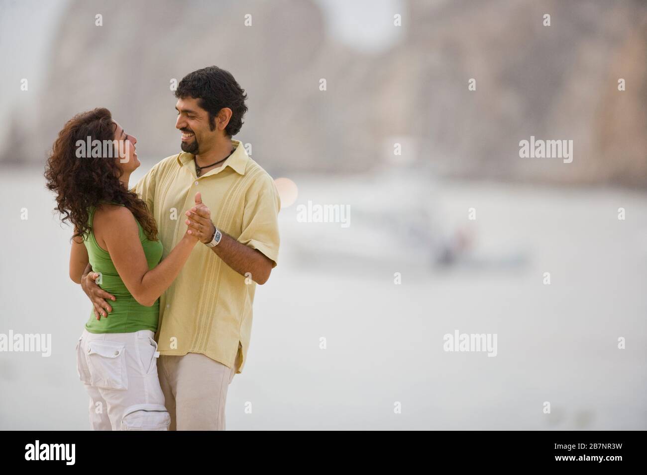 Couple dancing on the beach Stock Photo - Alamy