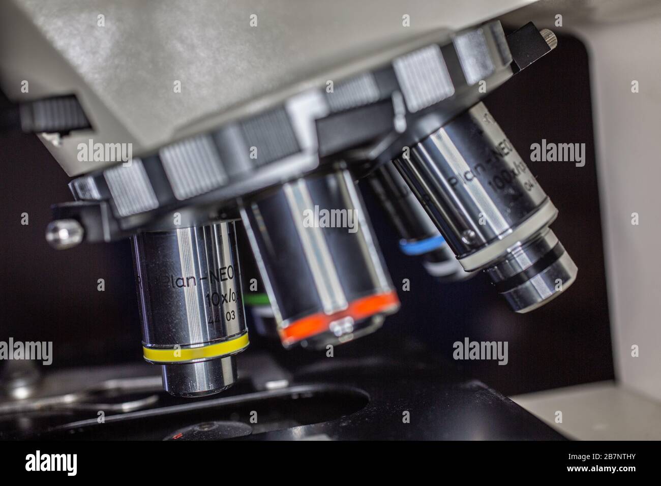 Nosepiece of a microscope with objectives Stock Photo Alamy
