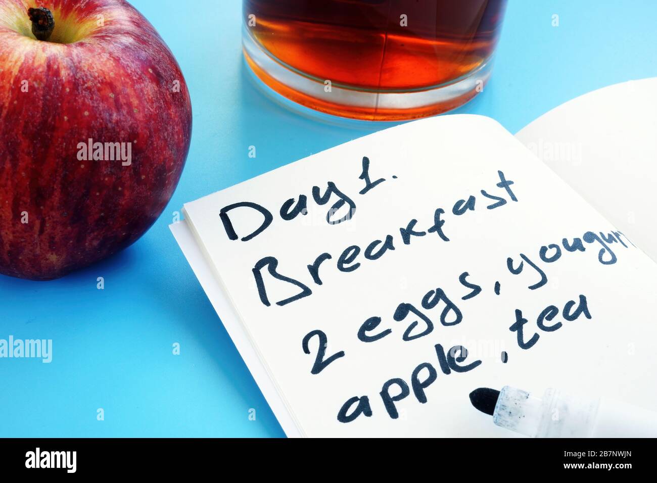 Diet meal plan for one day and apple. Stock Photo