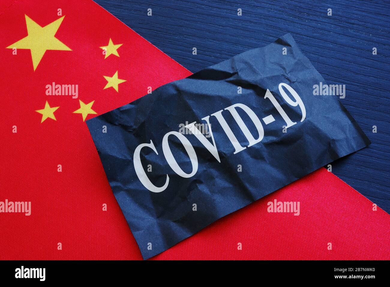 China flag and covid 19 coronavirus sign as symbol of wuhan chinese flu. Stock Photo