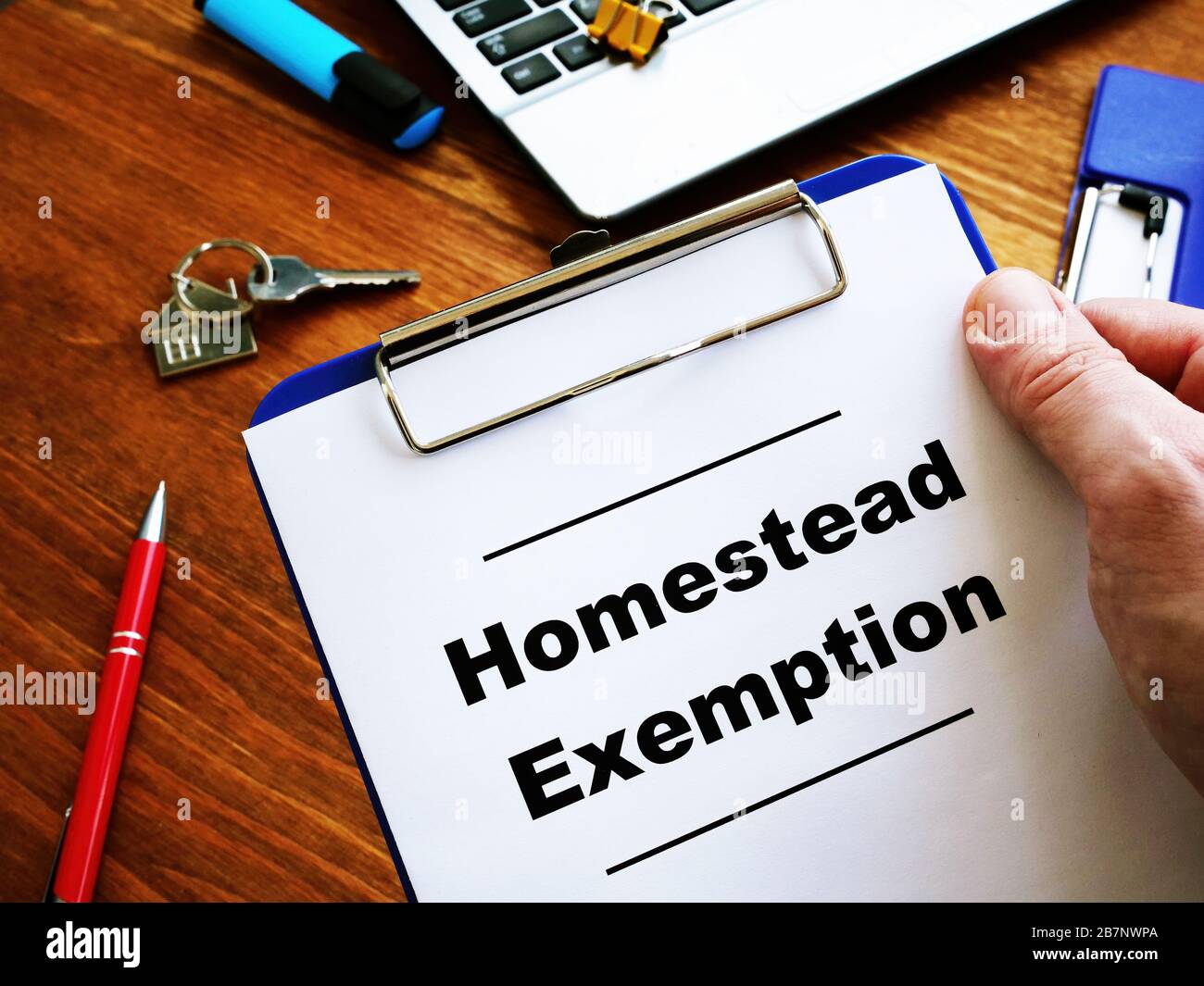 Man is reading Homestead Exemption at the home. Stock Photo